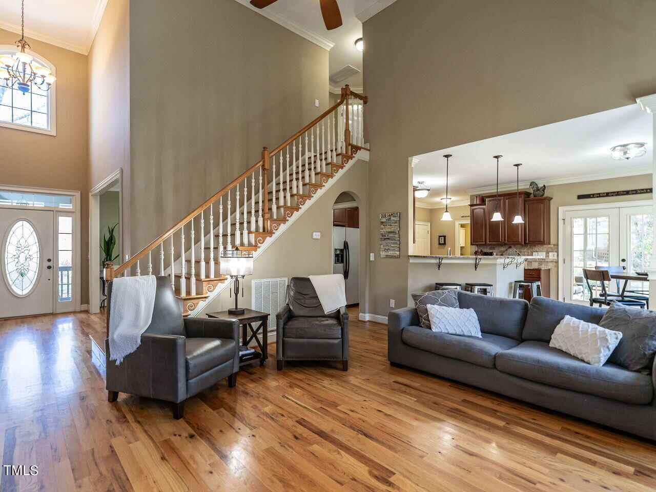 1173 Smith Creek Way Wake Forest, NC 27587 - Photo 9 of 42 a living room with furniture and wooden floor