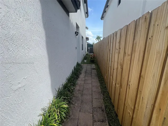 a view of a pathway with a white door
