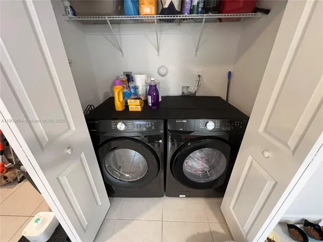a utility room with dryer and washer