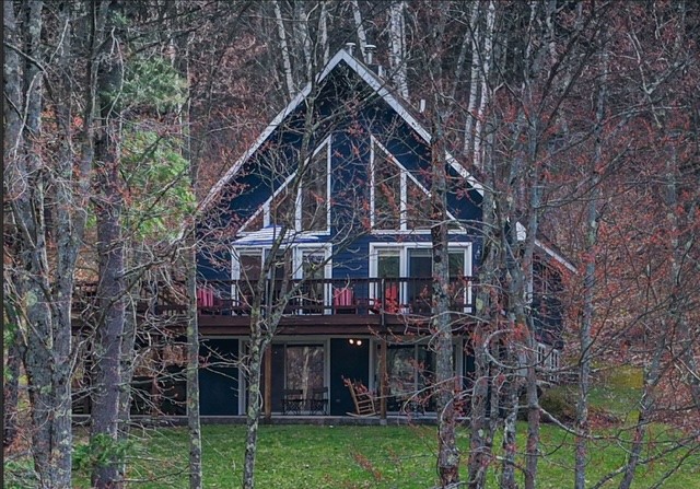207 Pheasant Run Road Middlefield, NY 13326 - Photo 2 of 44 Spacious Deck and Lower Patio glimpsed through the