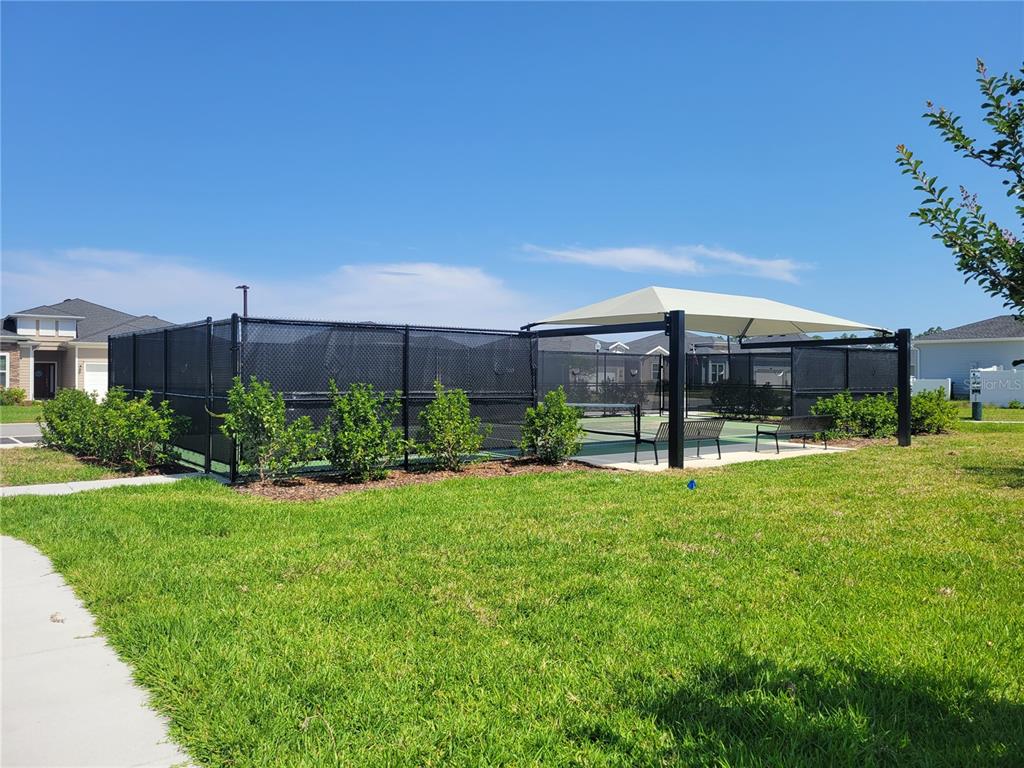 7796 Southwest 74th Loop Ocala, FL 34481 - Photo 19 of 20 a view of a house with backyard and sitting area
