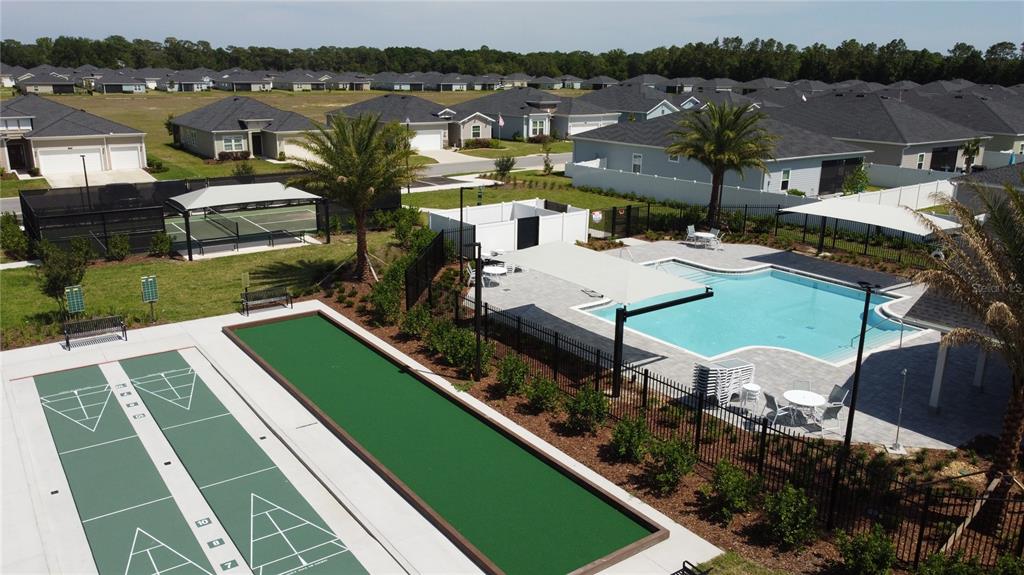 7796 Southwest 74th Loop Ocala, FL 34481 - Photo 20 of 20 an aerial view of a house with a garden and lake view