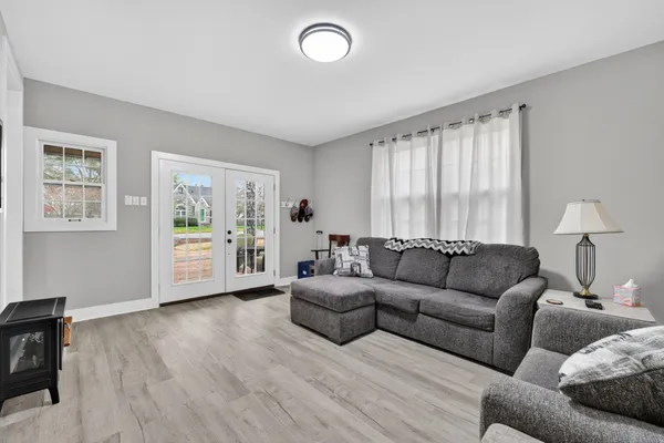 a living room with furniture and a window