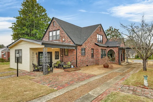 a front view of a house with garden