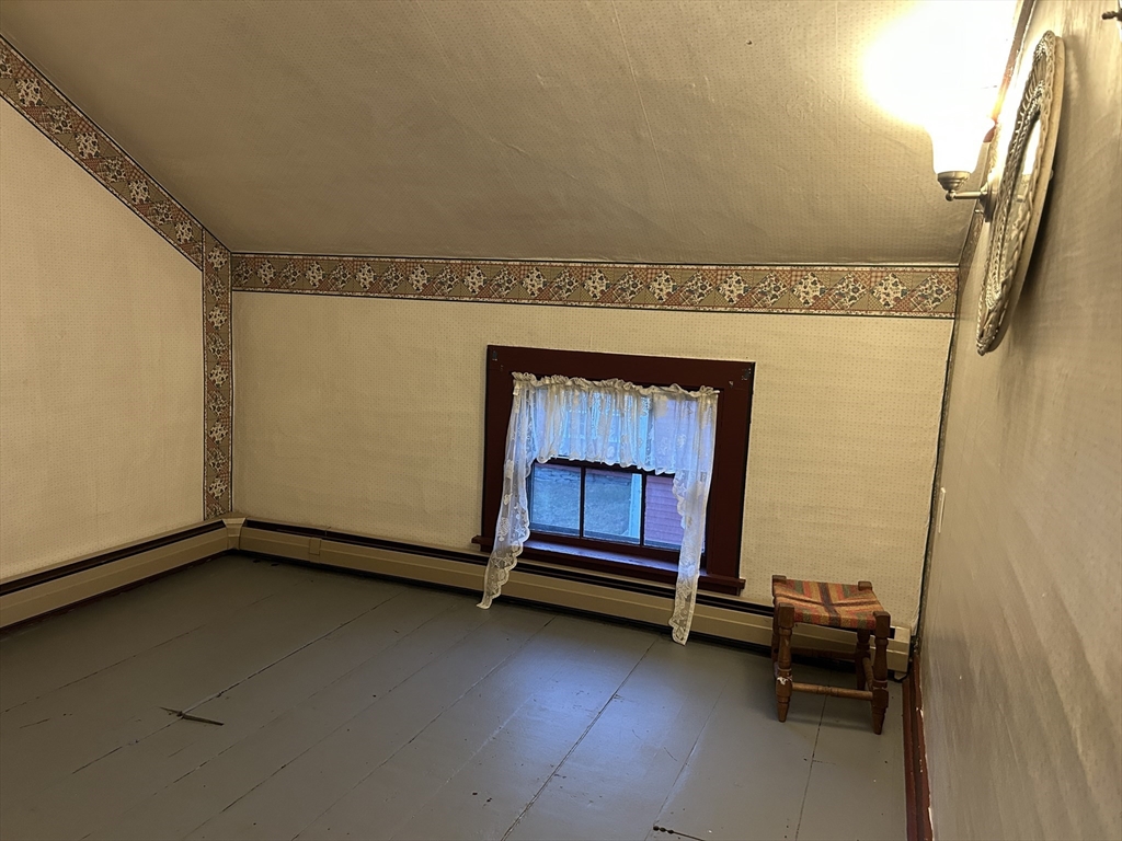 11 Maple Street Chester, MA 01011 - Photo 21 of 28 a view of an empty room and fire place