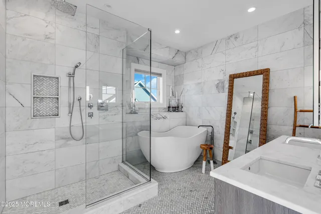 a bathroom with a tub and a shower