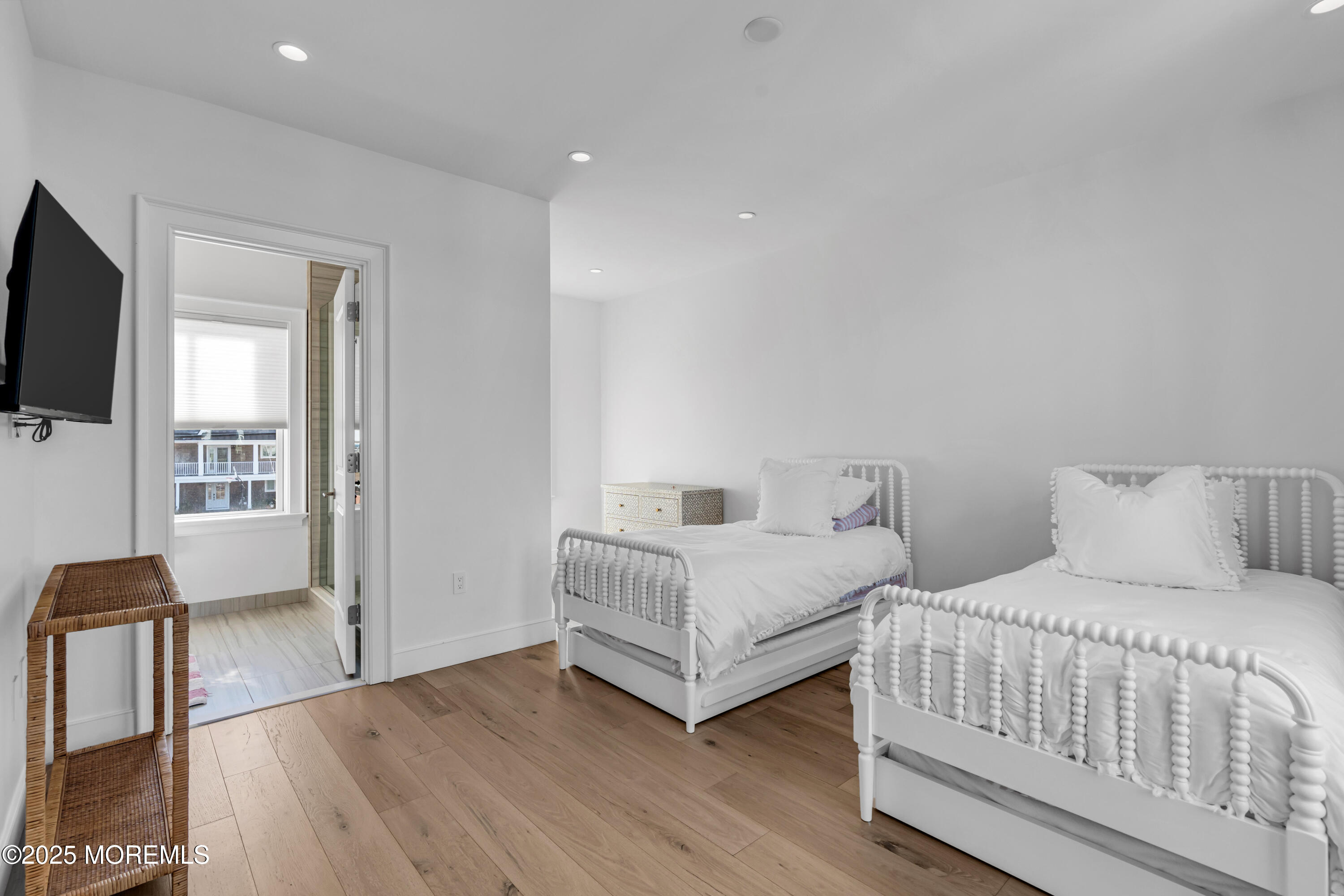 135 Highway 35 Mantoloking, NJ 08738 - Photo 16 of 36 a bedroom with two beds and a flat screen tv