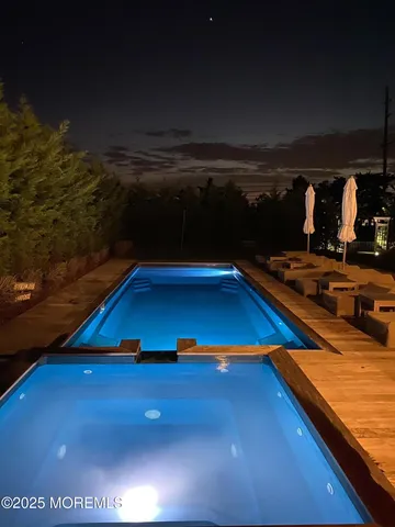 a room with pool table and window