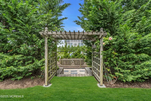 a view of a backyard with garden and plants