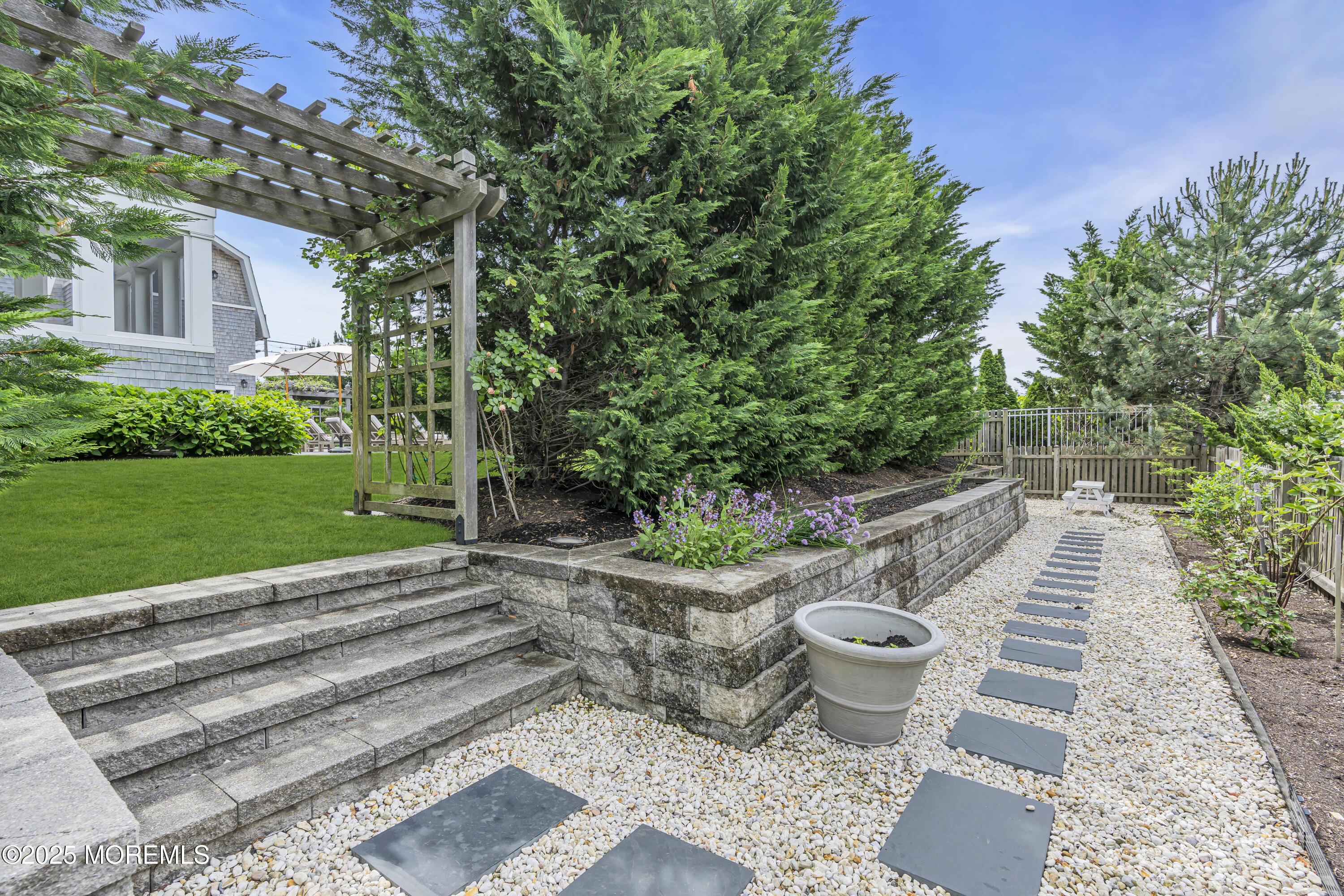 135 Highway 35 Mantoloking, NJ 08738 - Photo 33 of 36 a view of a backyard with garden and plants