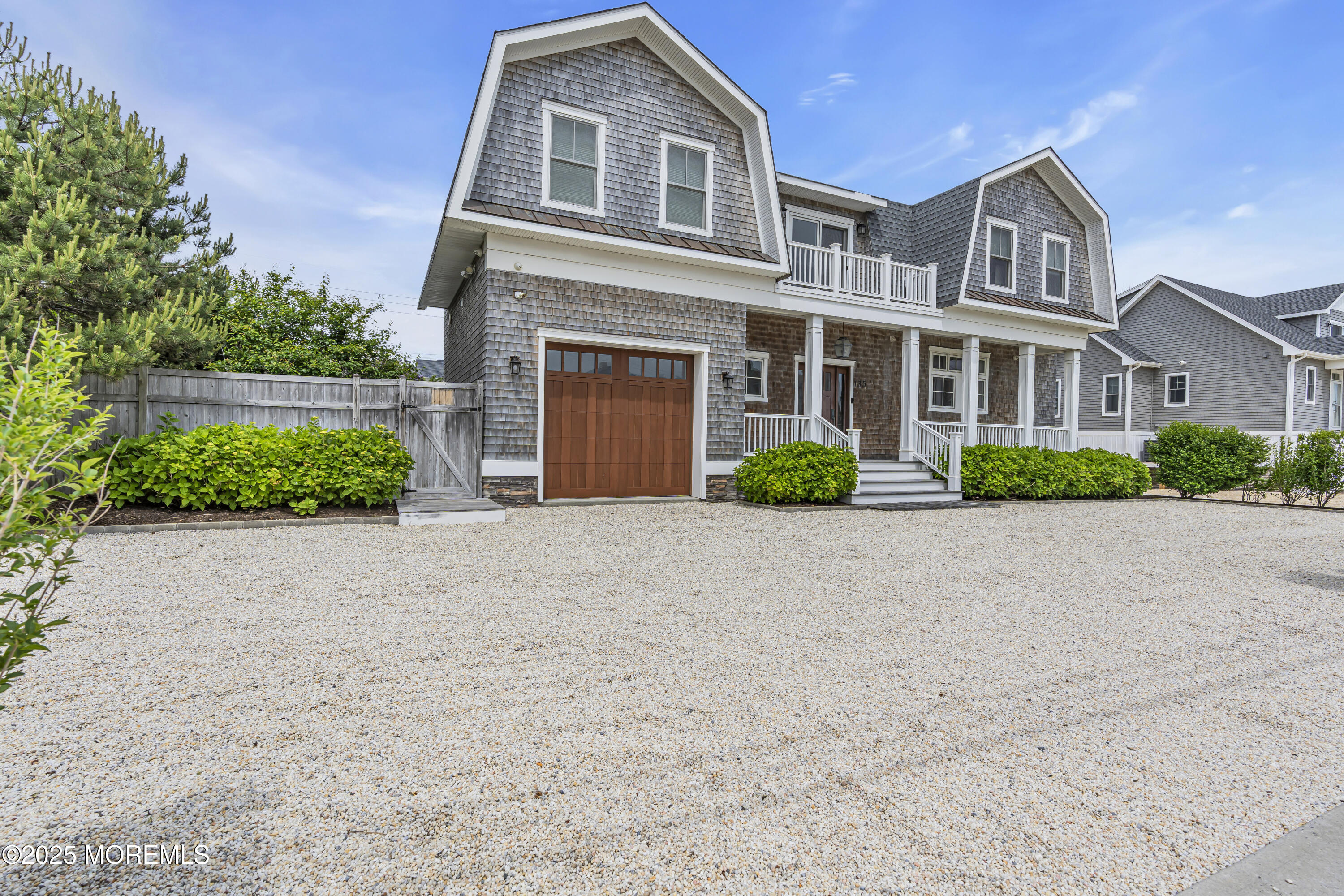 135 Highway 35 Mantoloking, NJ 08738 - Photo 34 of 36 a front view of a house with a yard and garage