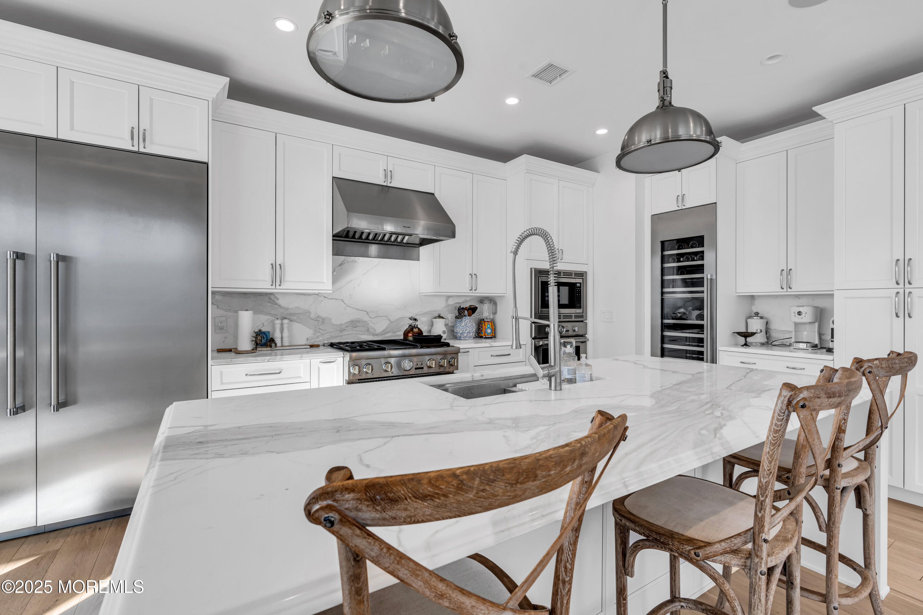135 Highway 35 Mantoloking, NJ 08738 - Photo 7 of 36 a kitchen with stainless steel appliances granite countertop a stove a sink and a refrigerator