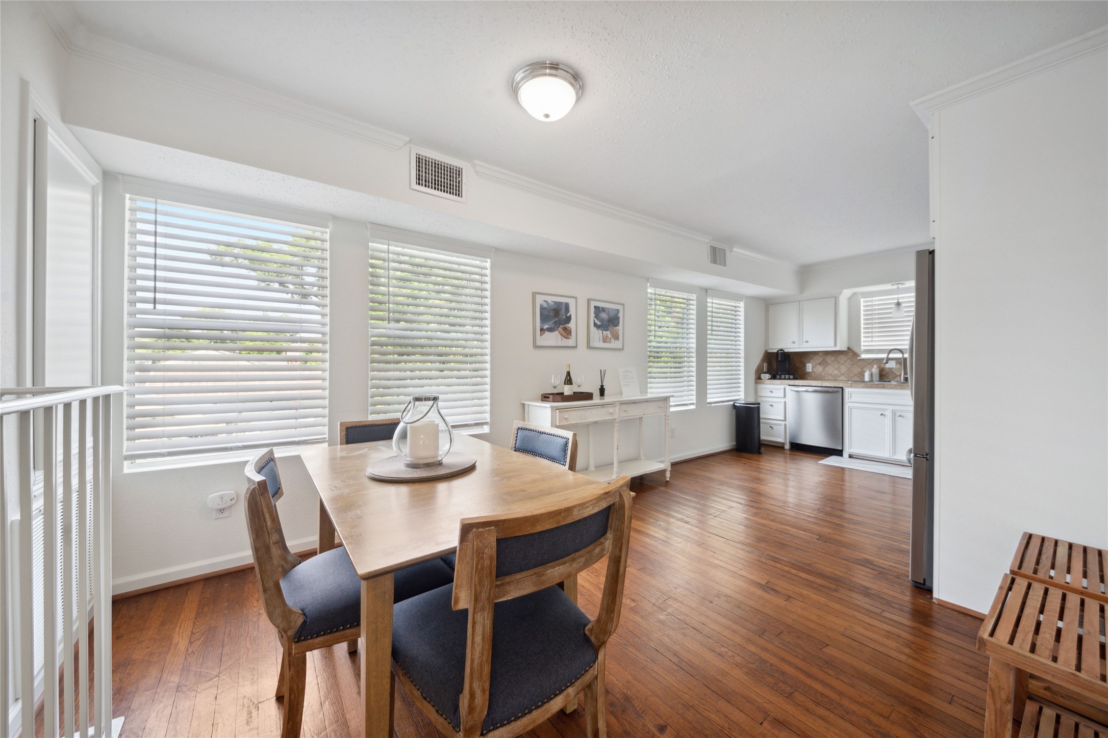 1105 Tulane Street, Unit B Houston, TX 77008 - Photo 5 of 24 a view of a dining room with furniture and wooden floor