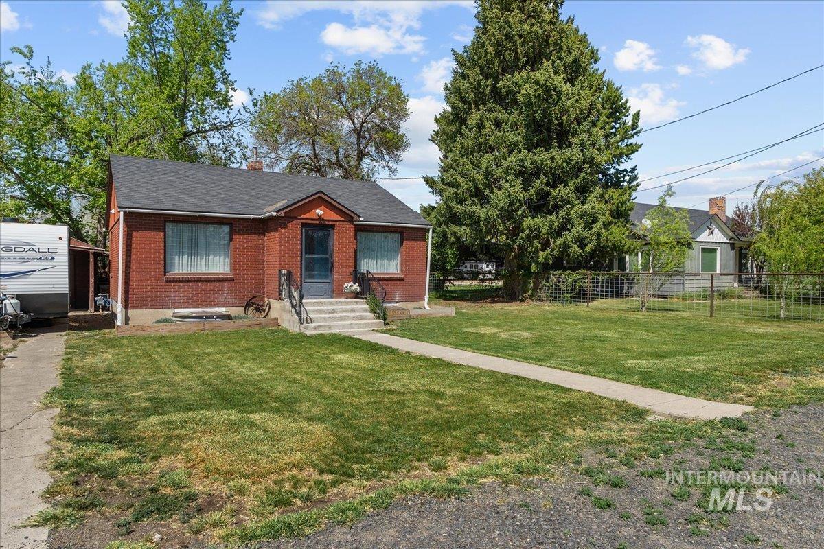 1958 East 1775 South Gooding, ID 83330 - Photo 5 of 49 Red brick home with a dark shingle roof