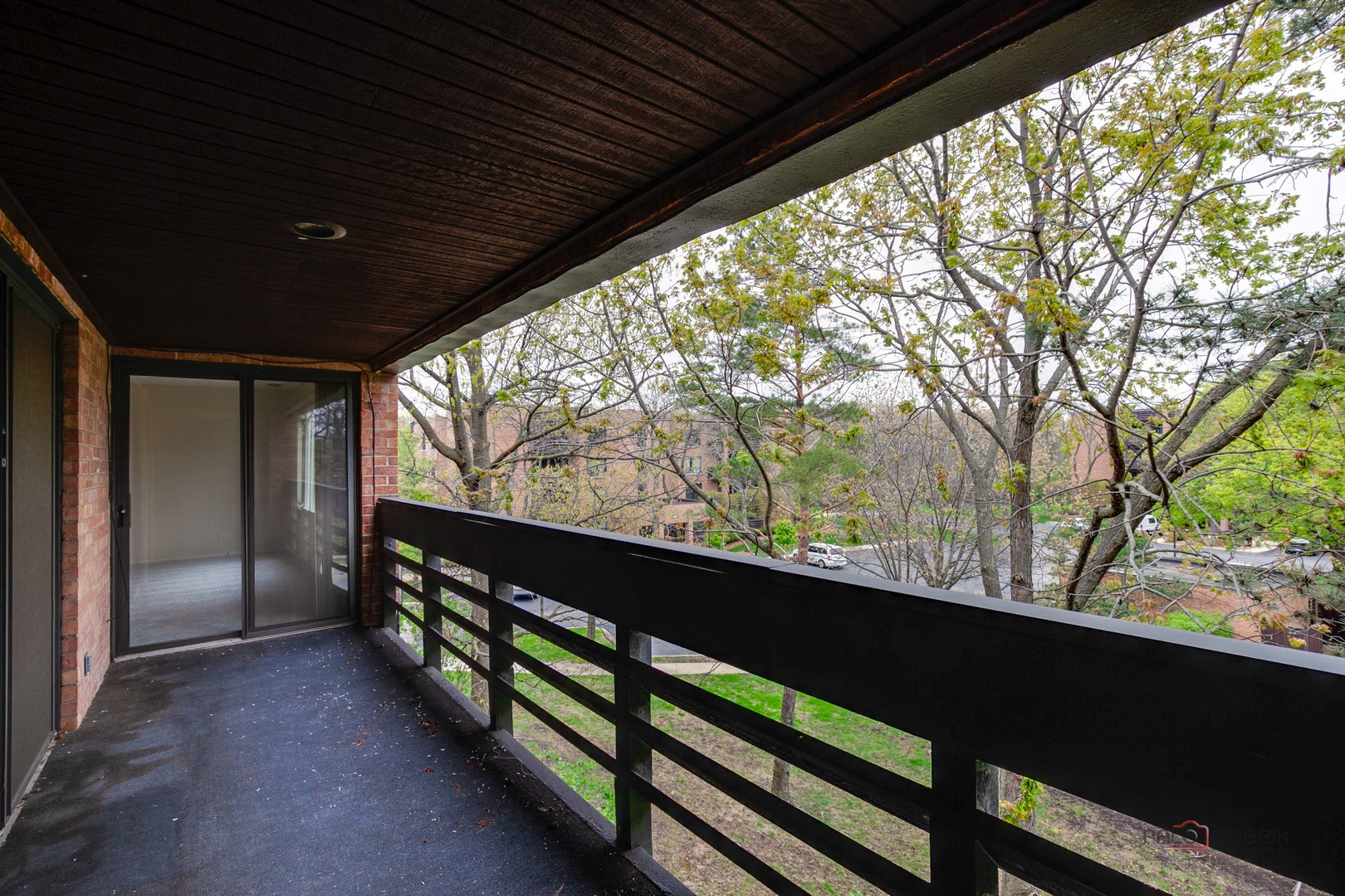 1088 Shermer Road, Unit 307 Northbrook, IL 60062 - Photo 33 of 35 a view of balcony with wooden floor and fence