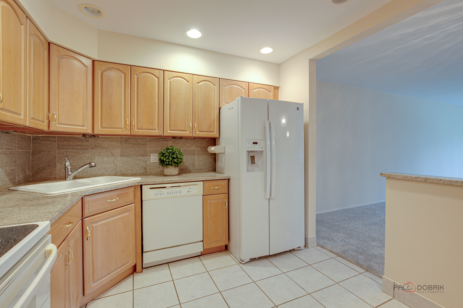 1088 Shermer Road, Unit 307 Northbrook, IL 60062 - Photo 8 of 35 a kitchen with white cabinets and white appliances