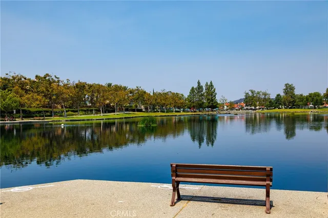 a view of a patio with table and chairs potted plants