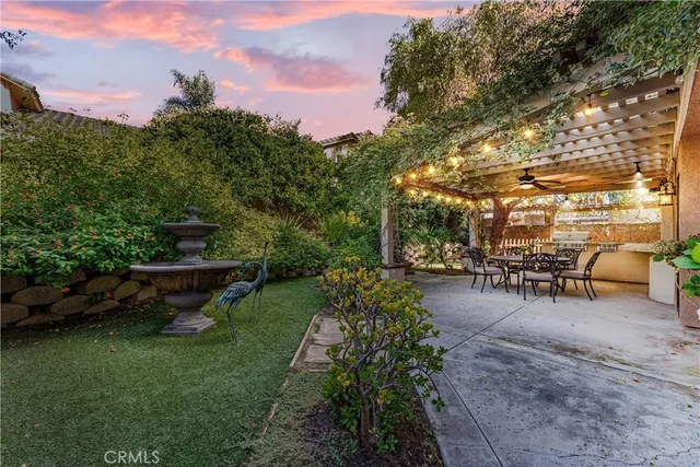 a view of a garden with sitting area