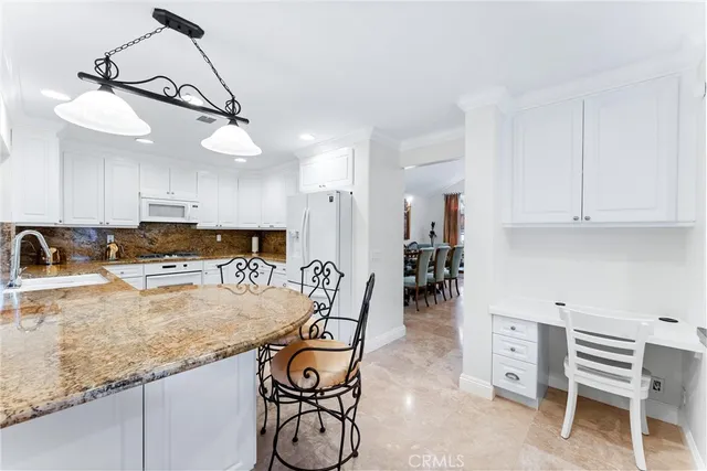 a bedroom with a bed and a table