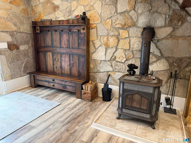 a view of fireplace and wooden floor