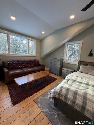a bedroom with bed and window