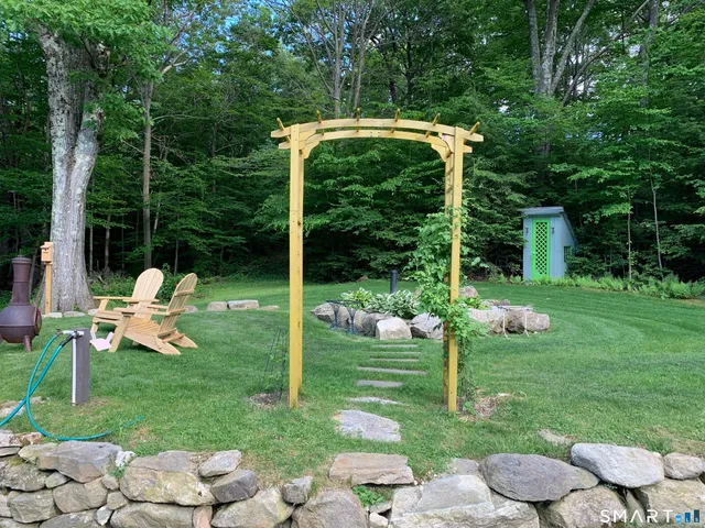 a view of a chair and tables in the garden