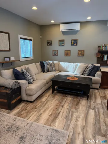 a living room with furniture and a rug