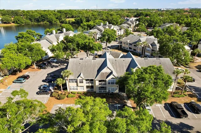 an aerial view of a house with lake view