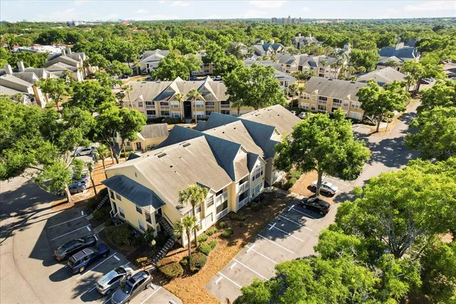 an aerial view of a house with yard