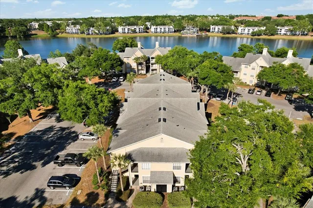 an aerial view of a house with a lake view