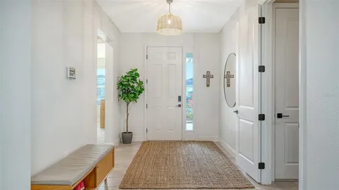 a bedroom with furniture and flat screen tv