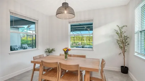 a bedroom with two beds and a chandelier