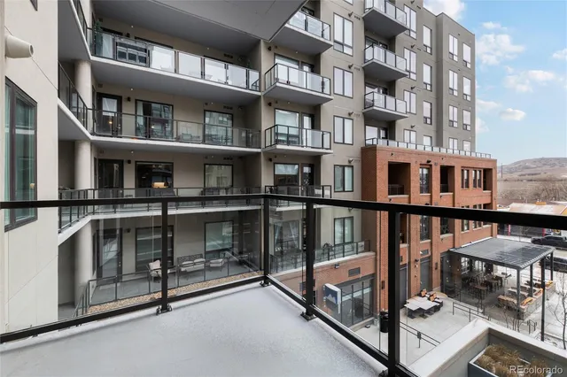 a view of front door and brick building