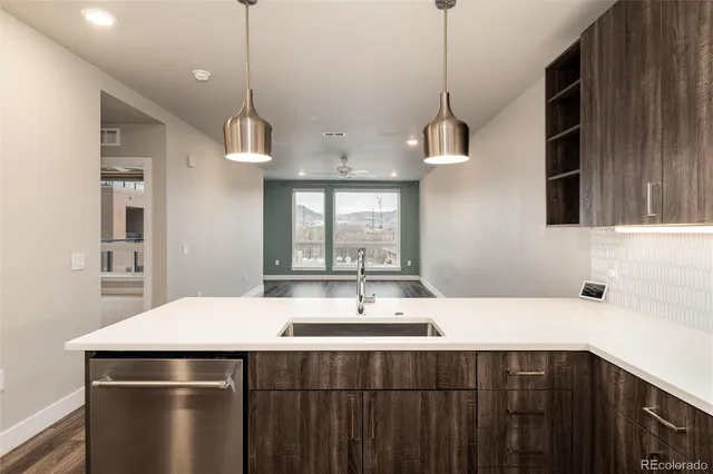 a kitchen with a sink and center island