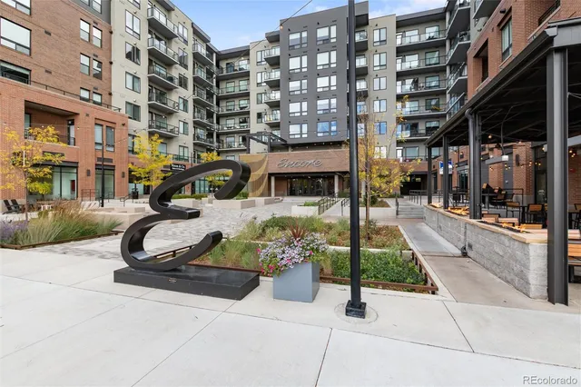 a view of a building with sitting area