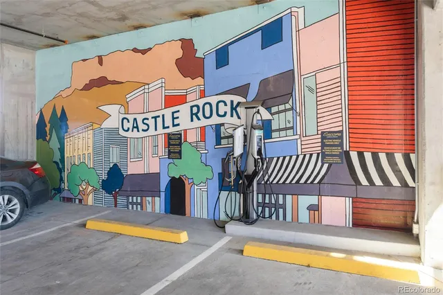 a balcony with table and chairs