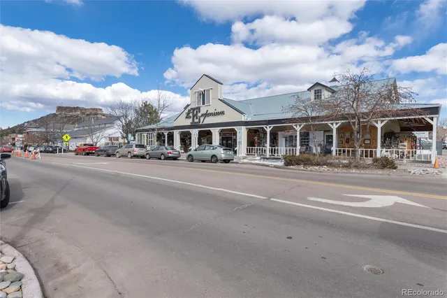 a front view of a building with a street