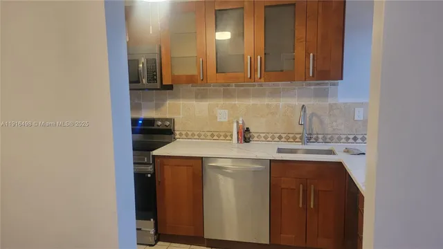 a kitchen with a stove and a microwave