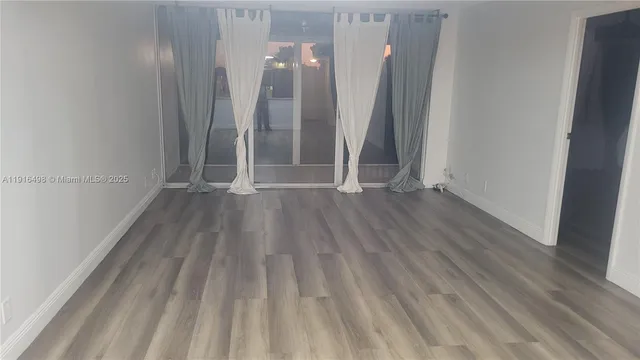 a view of kitchen and wooden floor
