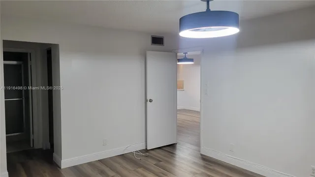 a view of cabinet with granite countertop