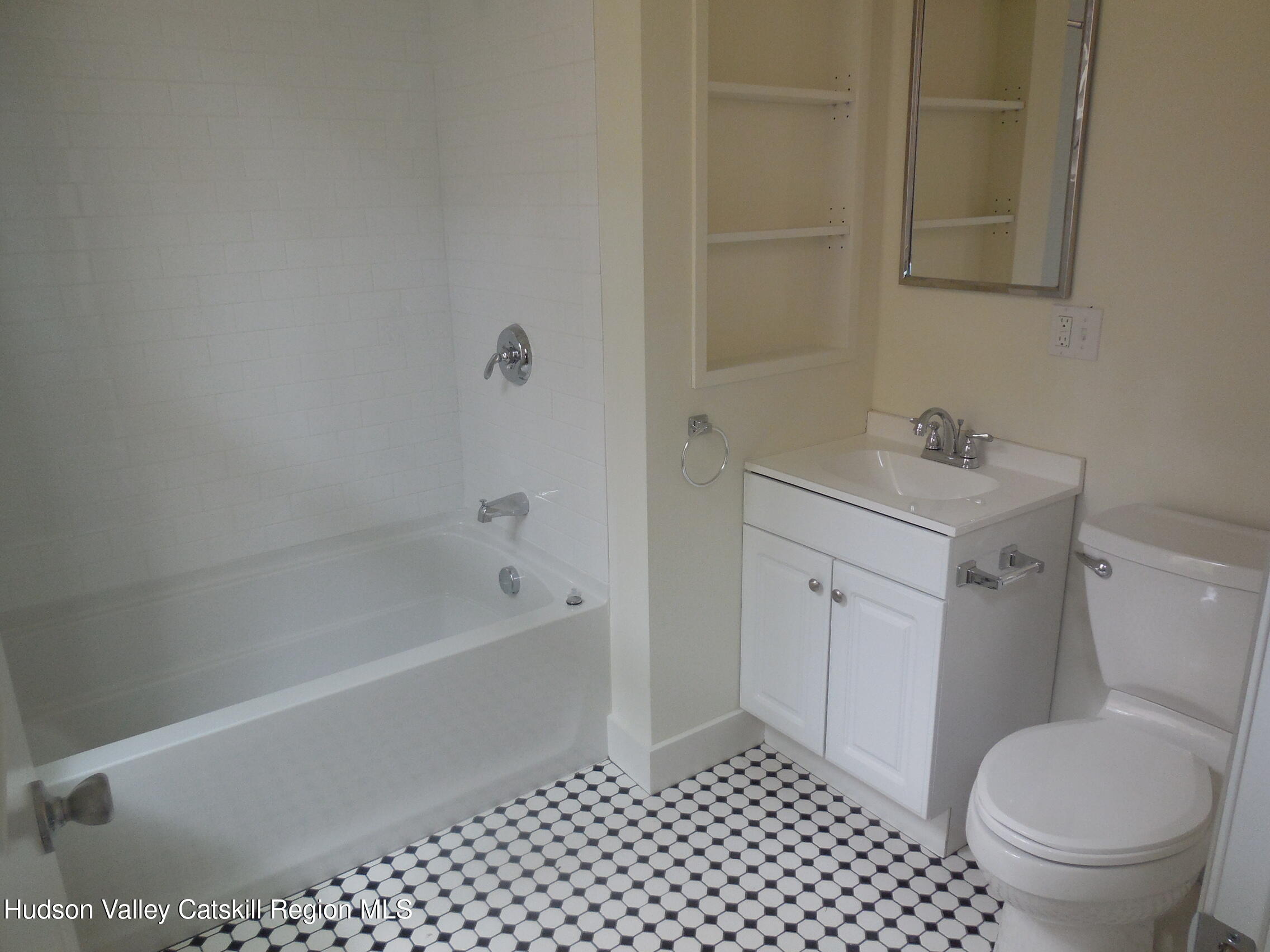 431 Warren Street, Unit 2 Hudson, NY 12534 - Photo 4 of 6 a bathroom with a sink a toilet and shower
