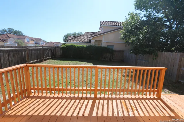a view of outdoor space with deck and furniture