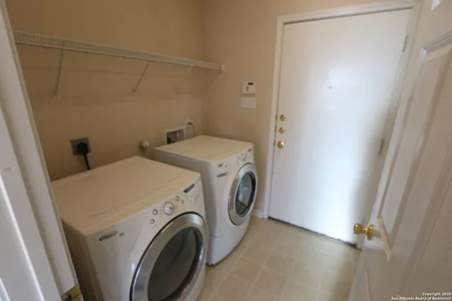 a utility room with dryer and washer
