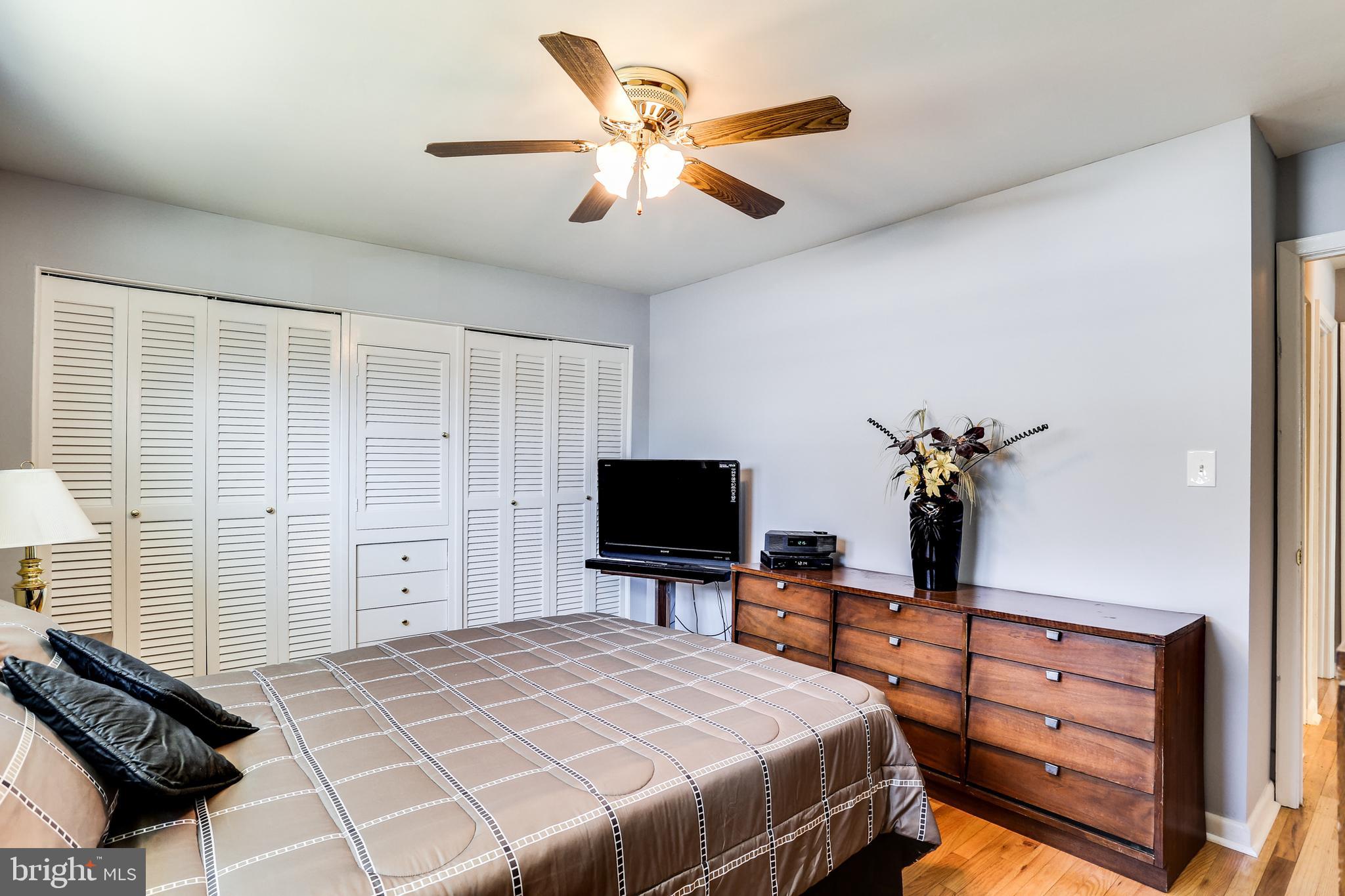 4602 Old Court Road Baltimore, MD 21208 - Photo 14 of 24 Master bedroom with hardwoods, built in and ceilin
