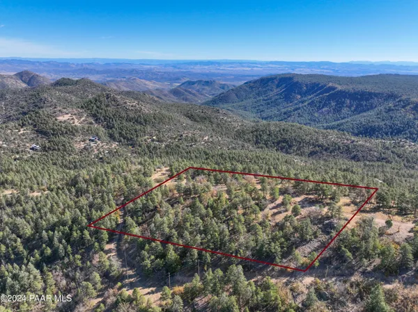 a view of a city with mountains in the background