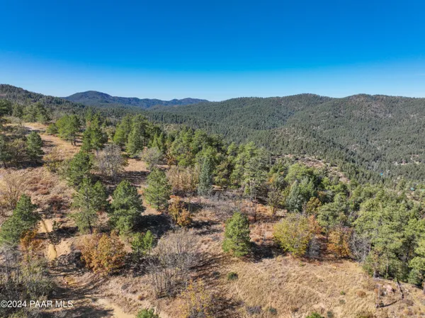 a view of a mountain range in a cloudy sky