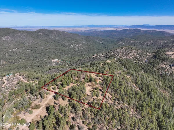 a view of a city with mountains in the background
