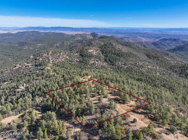 a view of a city with mountains in the background