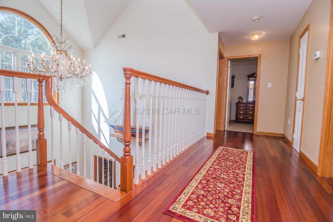 5115 Thomas Long Road Crisfield, MD 21817 - Photo 24 of 44 Upstairs Hall Hardwood Flooring