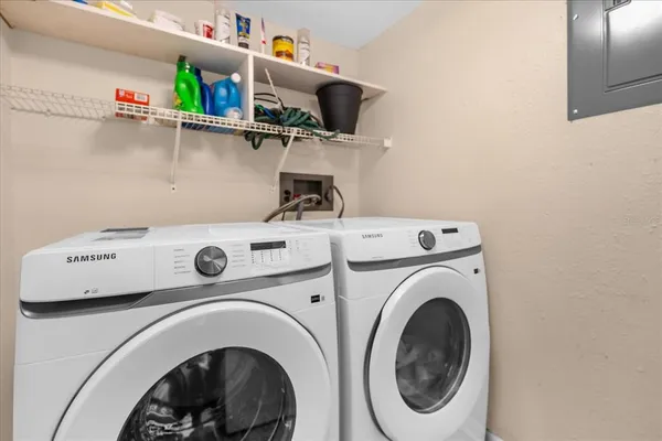 a balcony with chairs and a table